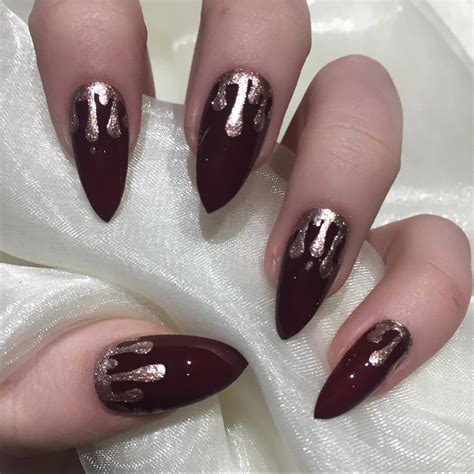 burgundy and gold nails|burgundy stiletto nails.